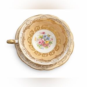 Charming Gold and White Teacup with Saucer